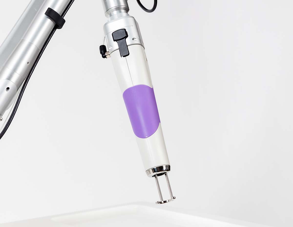 Astanza Trinity laser tattoo removal handpiece used at Modified Tattoo Gallery in Winter Park, FL