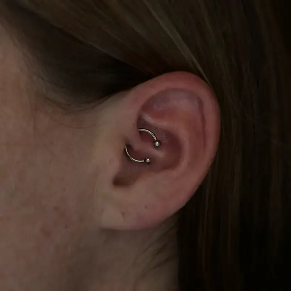 Daith piercing with a beaded circular barbell by T (Piercing Piranha) at Modified Tattoo Gallery in Winter Park, FL