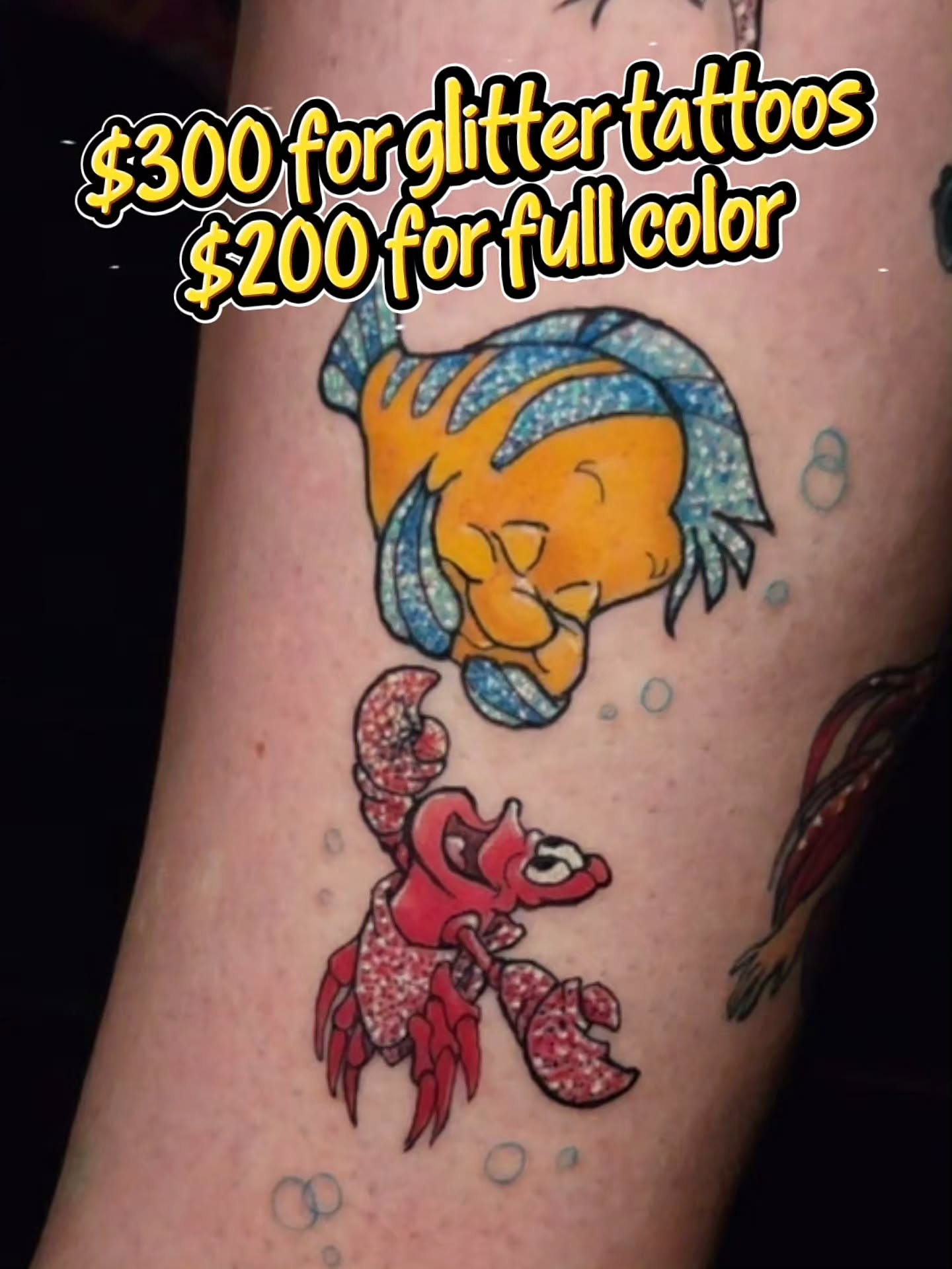 Palm-sized custom color and glitter tattoos of Flounder and Sebastian by Devilish Sherry at Modified Tattoo Gallery in Winter Park, FL
